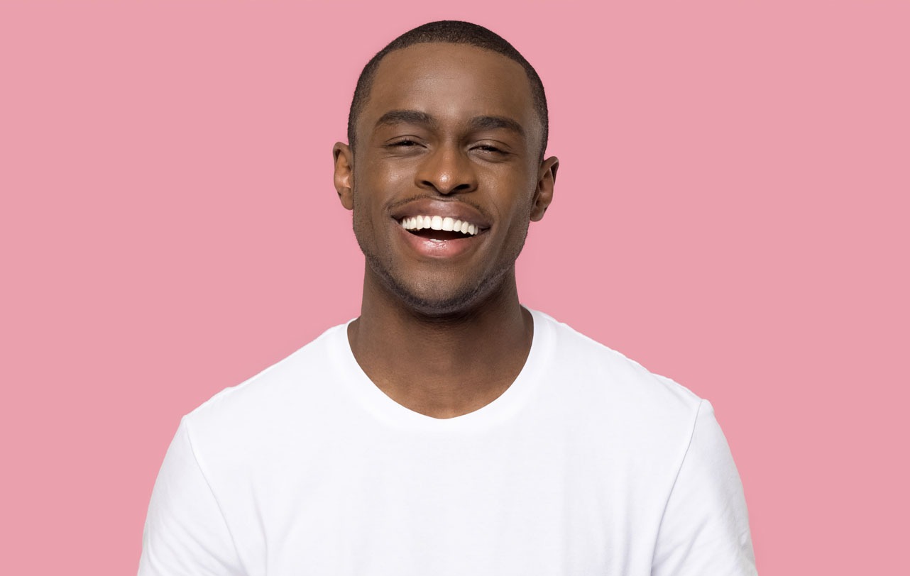 man smiling with straight white teeth